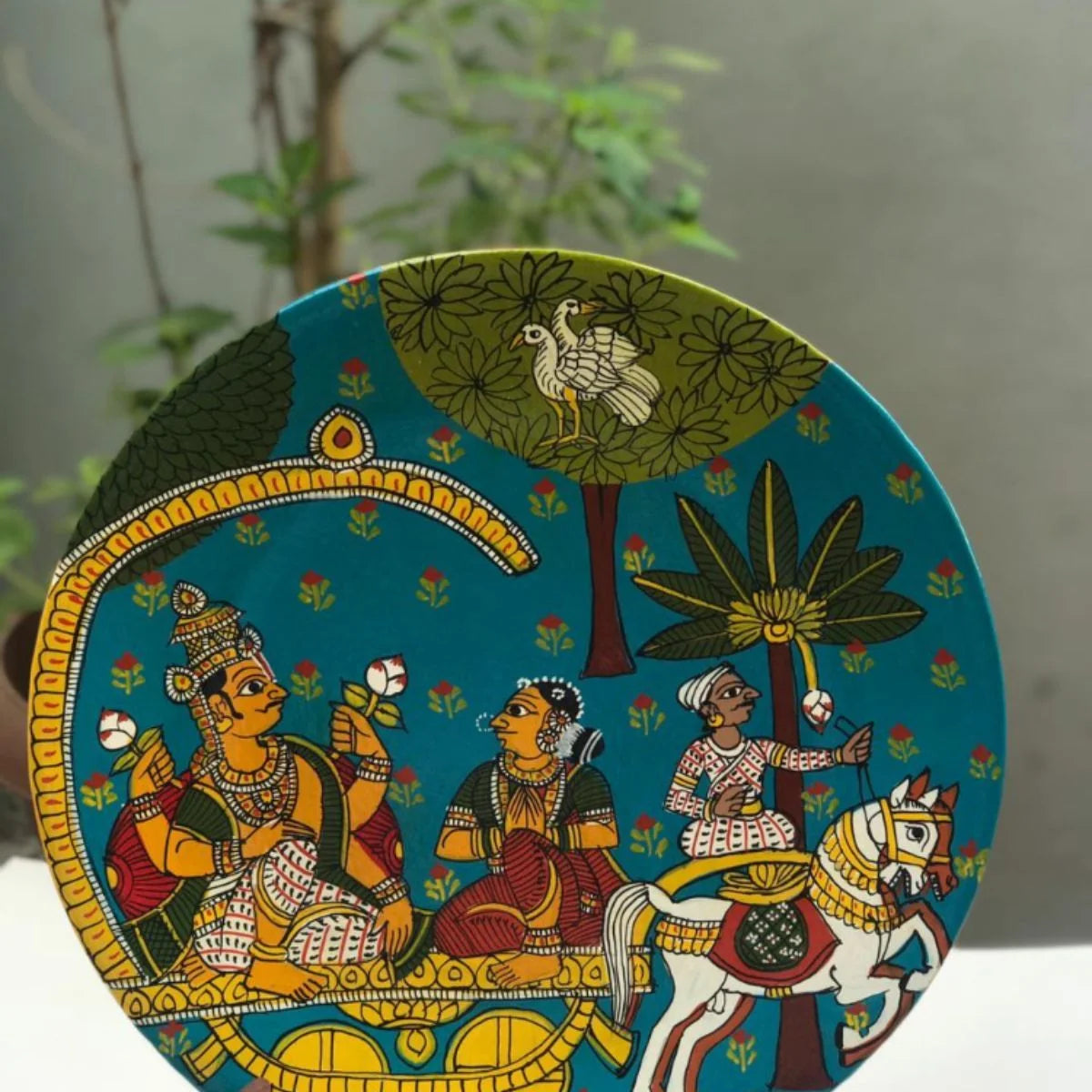Narayan hand-painted plate featuring intricate depictions of the deity in vibrant Cheriyal style