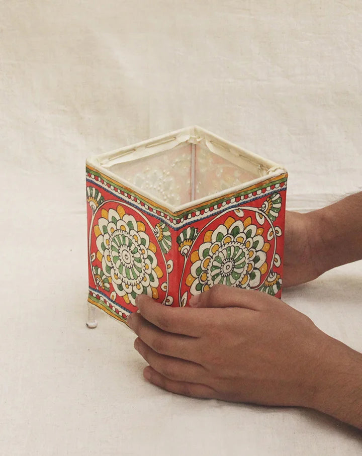 Kosha hand-painted Tholu table lamp with intricate designs, adding a warm artisan glow to your space