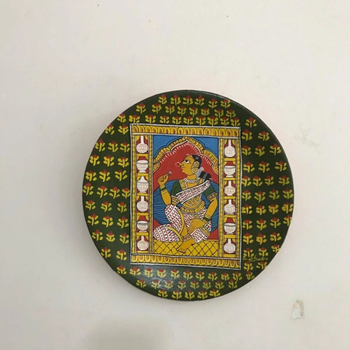 Sundari Cheriyal hand-painted plate featuring a depiction of beauty in intricate traditional designs