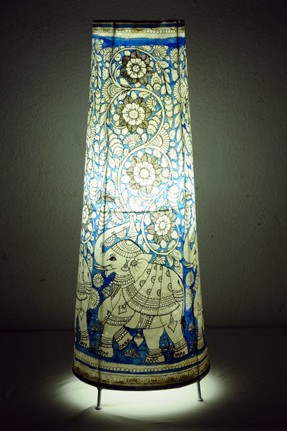 Gajraaj hand-painted Tholu tall corner lamp with intricate elephant designs, a striking artisan piece for ambient lighting